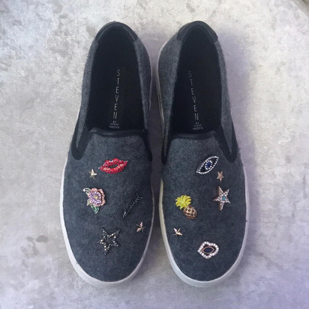 Steve Madden slip ons with assorted jewels.
